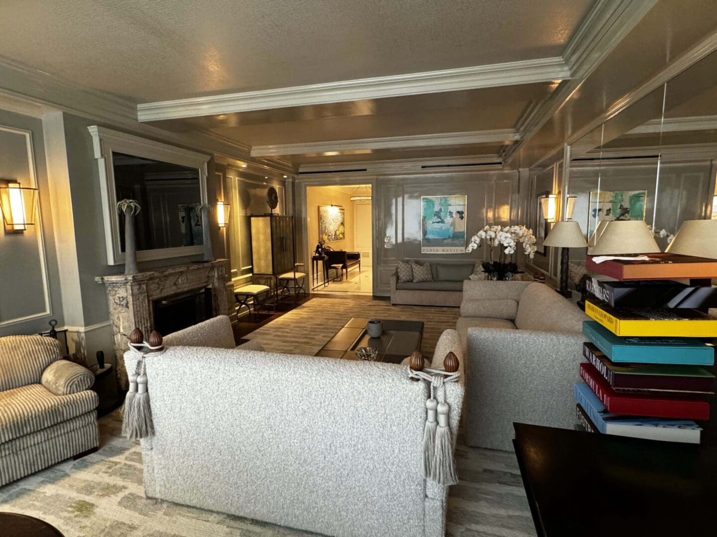 Elegant living room with modern furniture and warm lighting.