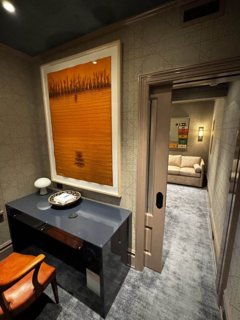 Cozy hallway leading to a warmly lit living room with modern decor.