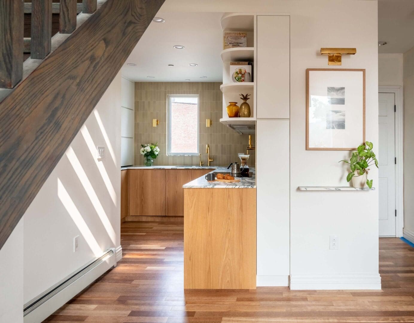 A bright modern kitchen with wooden accents and natural light.