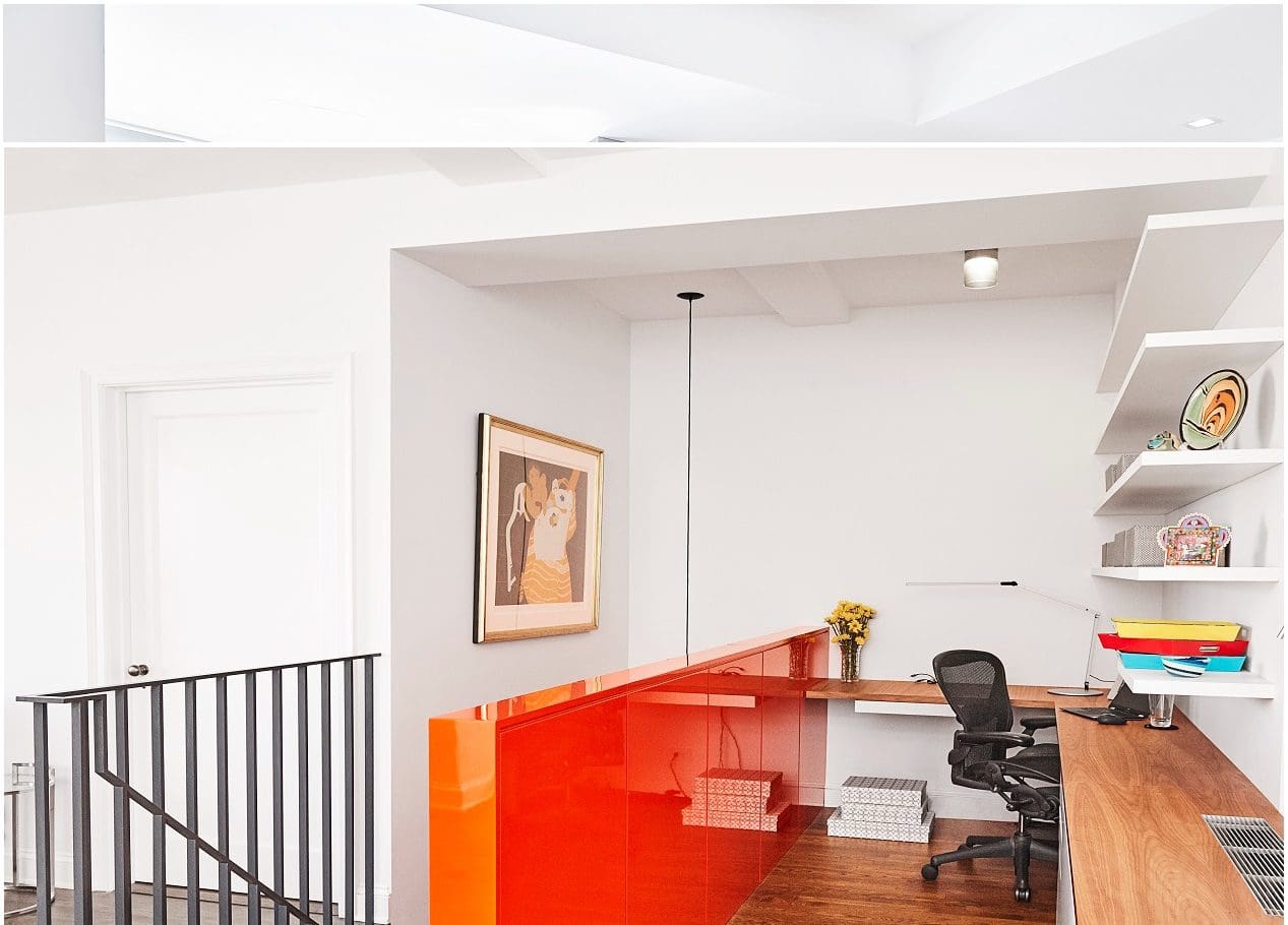 Modern home office with red cabinets and a cozy workspace.