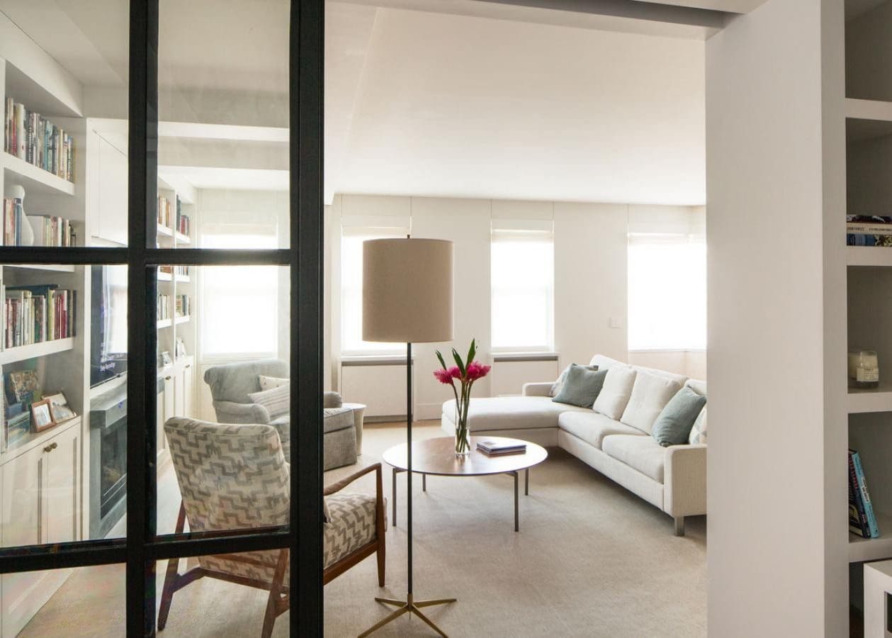 Bright, modern living room with cozy seating and natural light.